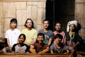 USP faculty member A/P Peter Vail (in yellow shirt) and USP students with the villagers.