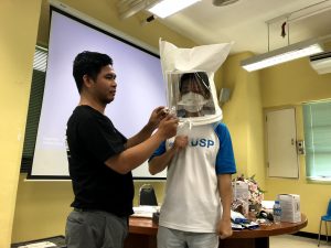 Prof Kang trying out the Mask Fit Test to see if any contaminants can still enter his respiratory system